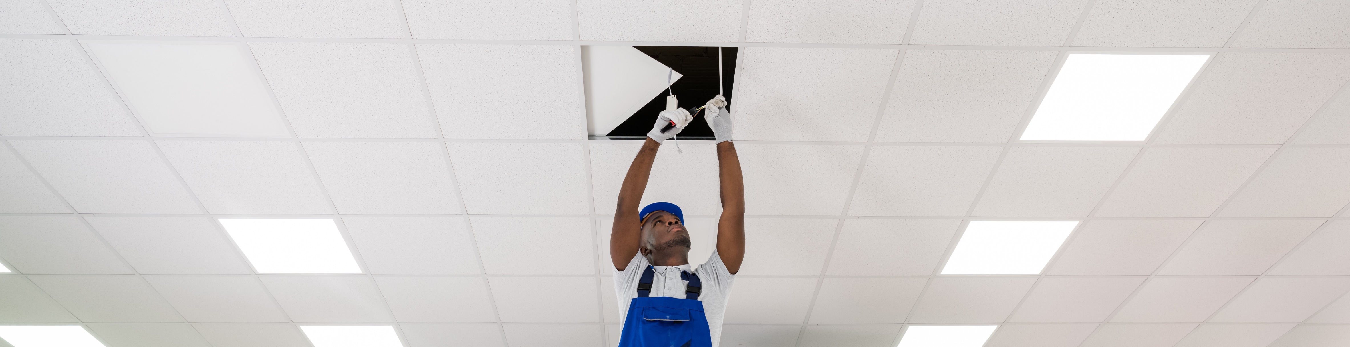 Man working in overhead ceiling